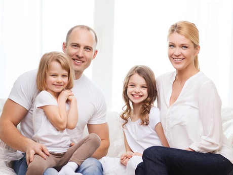 family-children-home-concept-smiling-parents-two-little-girls-home.jpg