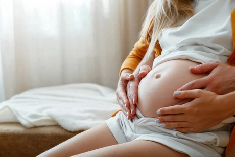 Parents touching pregnant belly.jpg