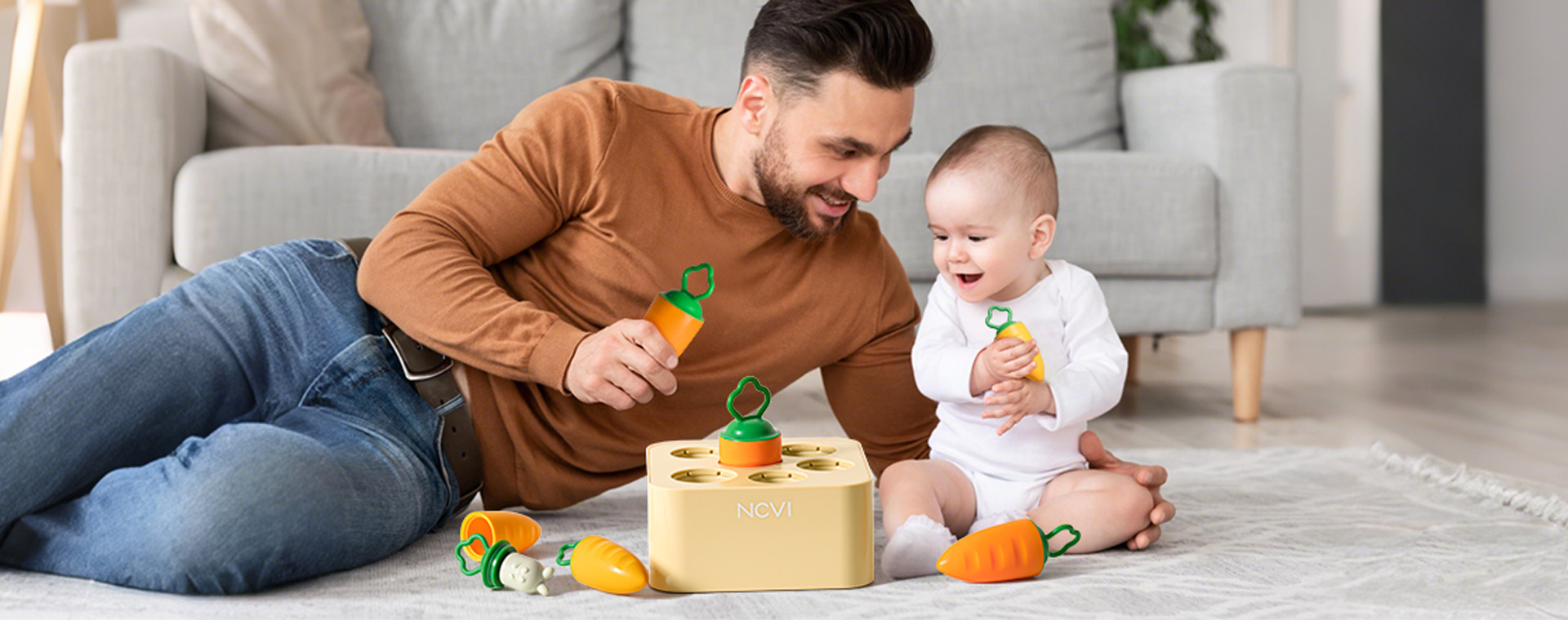  The father and the baby are playing with the NCVI Baby Carrot Bunny Picking Toy for Harvest Games in the living room_